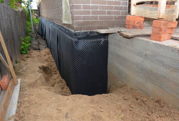 SJ Waterproofing Pros technician performing targeted Wet Basement Repair assessment in Fishers, IN